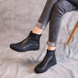 Black leather flat ankle boots